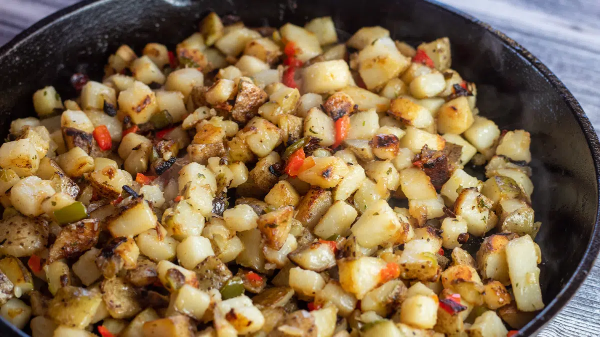 Wide overhead image of the potatoes O'Brien ready to serve for breakfast.