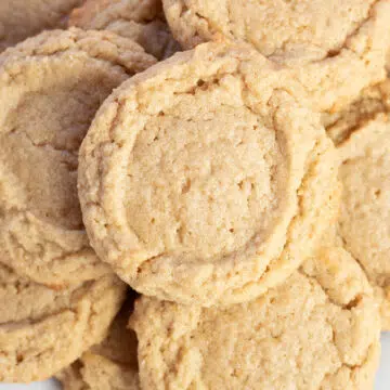 Wide overhead image of multiple peanut butter cookies.