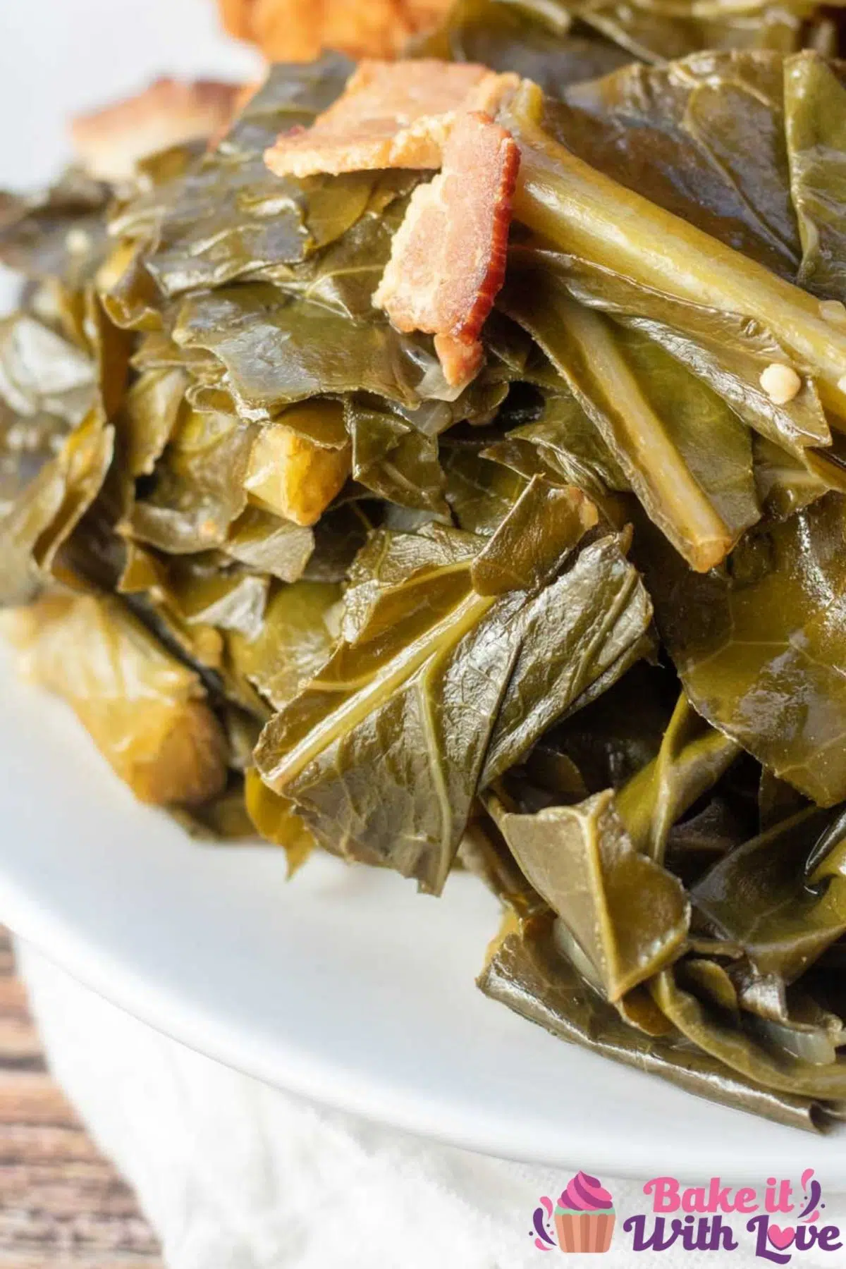 Tall closeup image of the cookied Instant Pot collard greens on white plate.