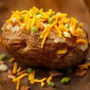 Perfectly fluffy microwave baked potato topped with cheese, bacon, and more.