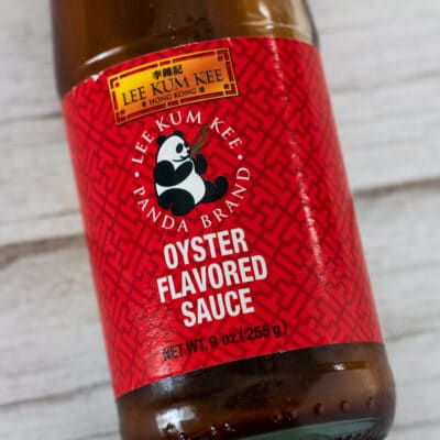 Best Oyster Sauce Substitute to use in cooking with bottled sauce on light background.