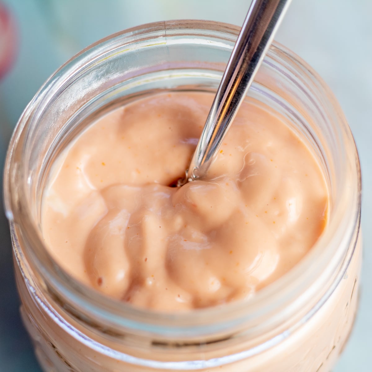 Square image of the homemade Russian dressing in jar.