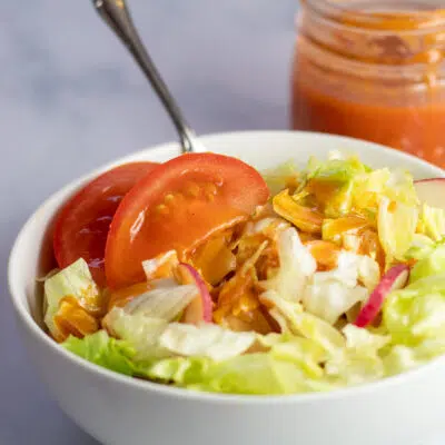 Square image of salad with catalina dressing.