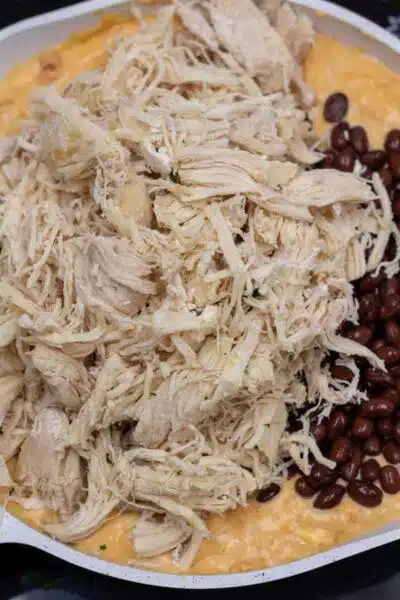 Process photo 4 add shredded chicken and drained black beans.