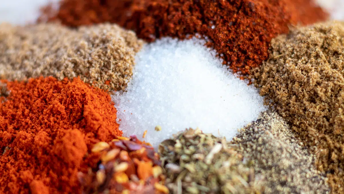 Wide closeup of the measured out chicken taco seasoning ingredients on parchment paper.