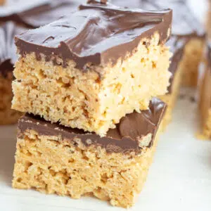 Square image of two chocolate peanut butter rice krispies.