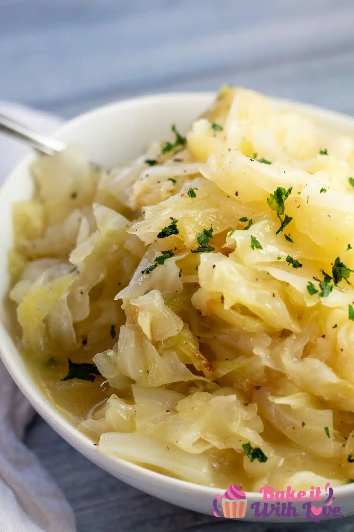 Tall image of the Instant Pot buttered cabbage served in bowl.