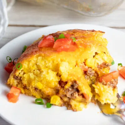 The best Mexican cornbread casserole dished up on white plate for family dinner.