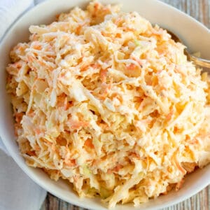 Square image of Southern coleslaw in a white bowl.