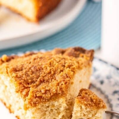 Best homemade Bisquick coffee cake recipe based on the Original, pin with sliced piece and coffee in background.