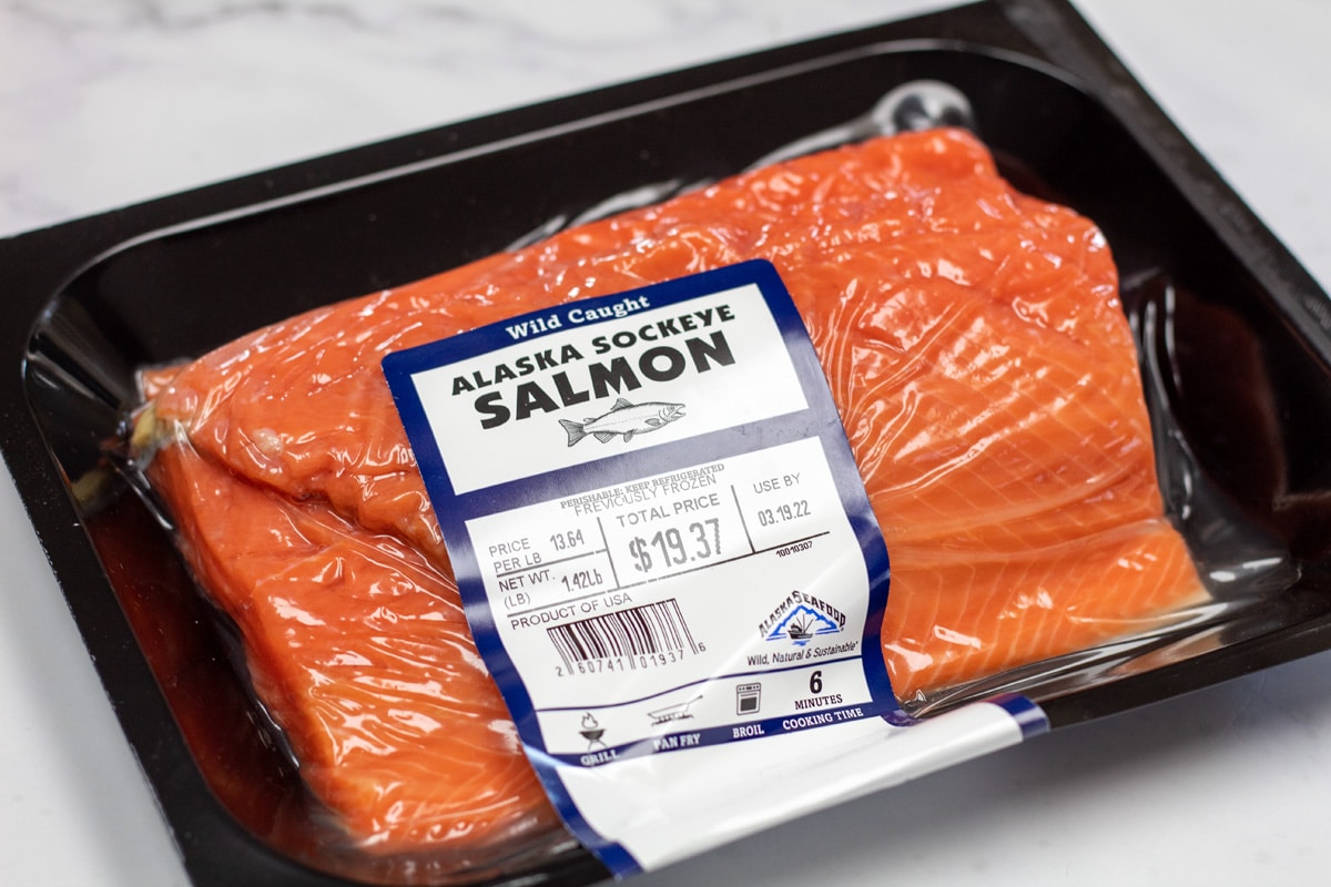 Air fryer salmon ingredients with packaged sockeye salmon.