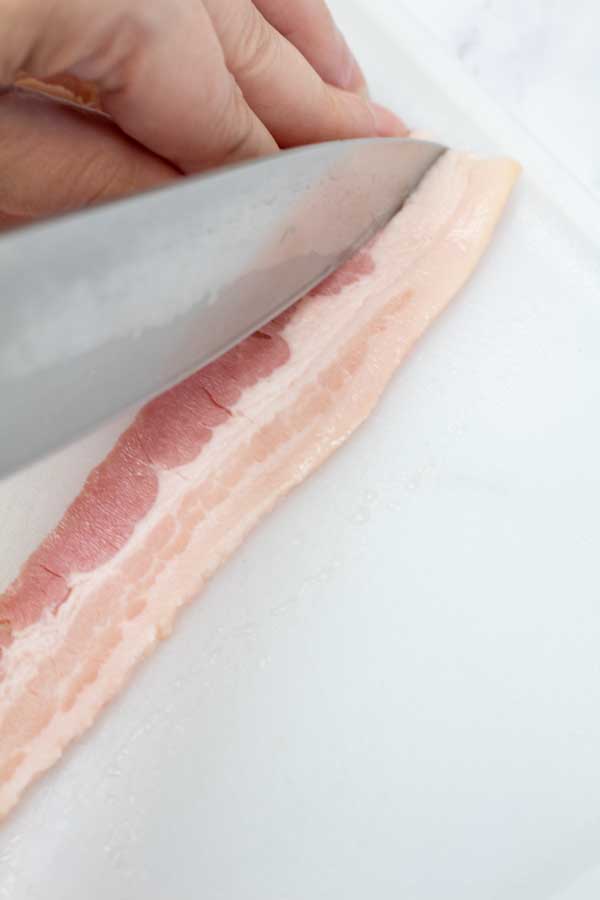 Process photo 1 slice bacon strips in half lengthwise.