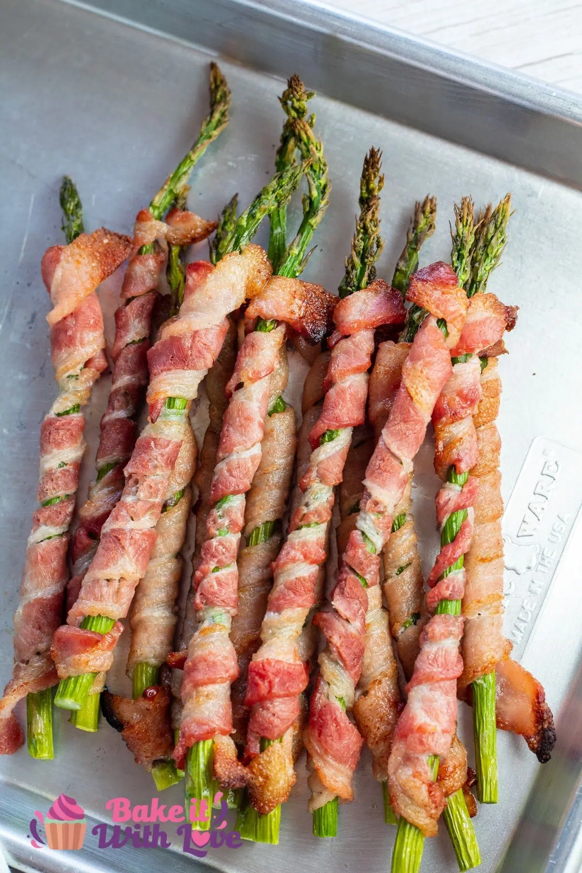 Tall overhead image of the baked bacon wrapped asparagus spears.