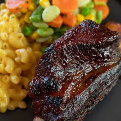 Pin image with text of baked bbq short ribs.