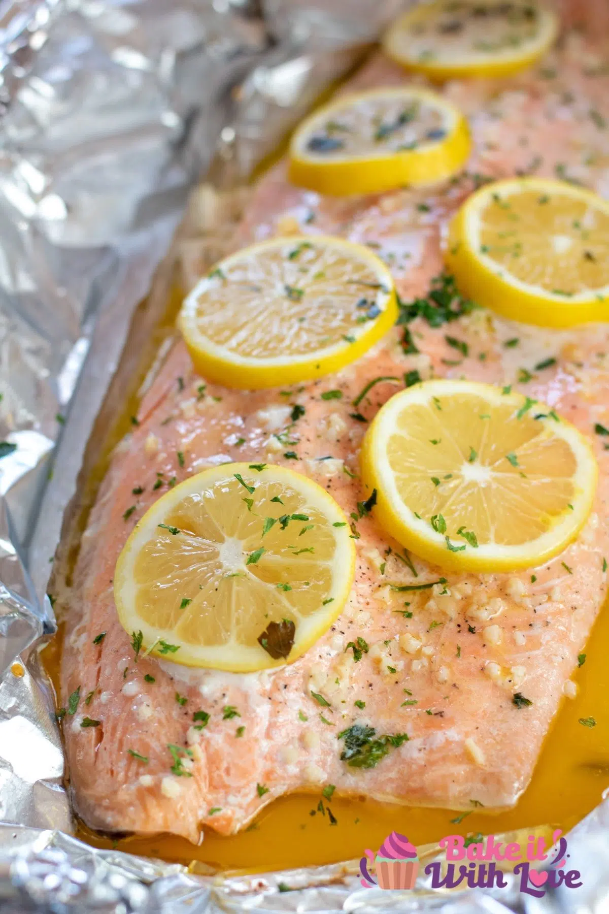Baked steelhead trout in foil pouch with garlic, butter, and lemon sauce.