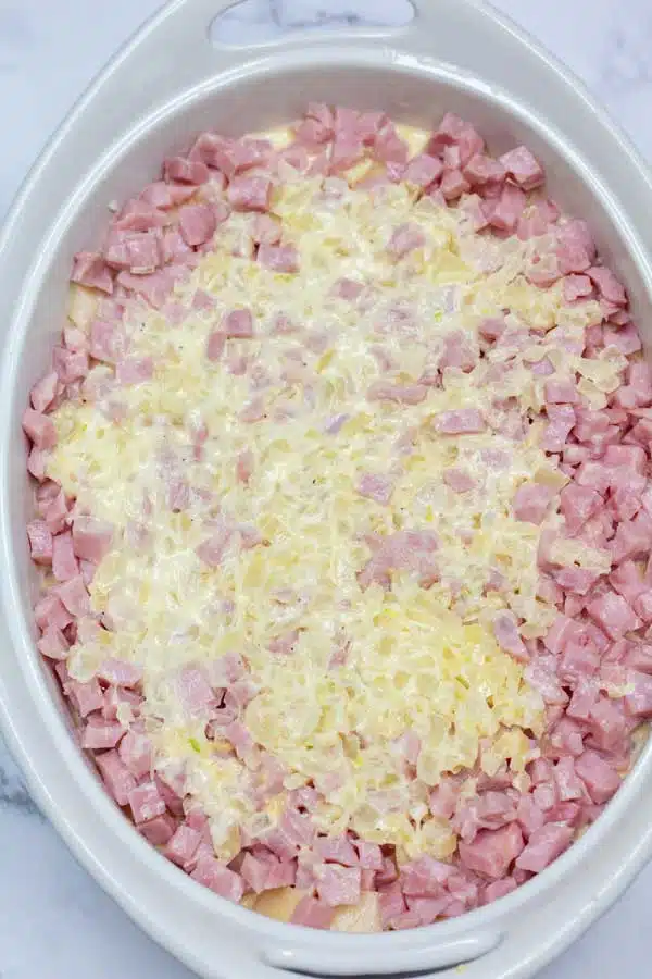 Process image 5 showing casserole dish with ham and cheese.