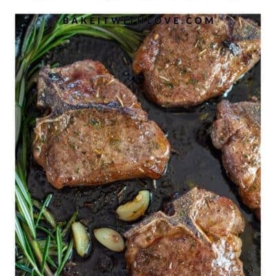 Pin image with text divider of lamb chops in a cast iron pan with garlic and rosemary.