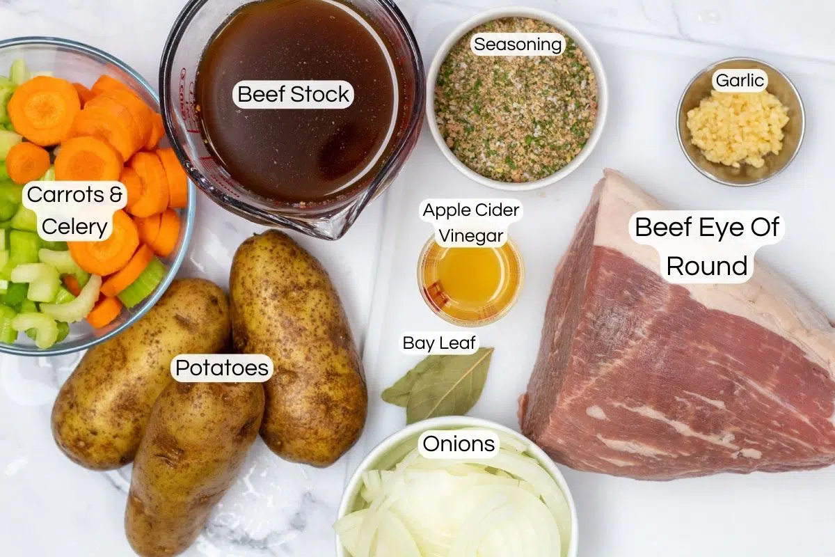Slow cooker eye of round beef roast ingredients with labels.