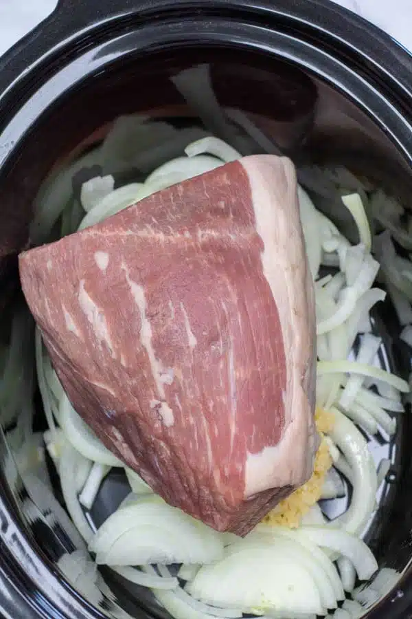 Process photo 2 place the eye of round beef portion in the center of your crockpot.
