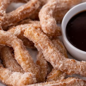 Homemade fried churros rolled in sugar and served with chocolate dipping sauce.