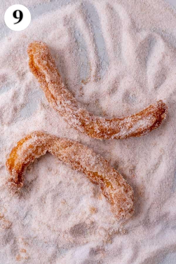 Homemade churros recipe process photo 9 churros being rolled in sugar.