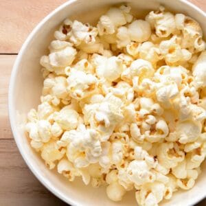 Easy stovetop popcorn pops up light and fluffy like this tasty bowl!