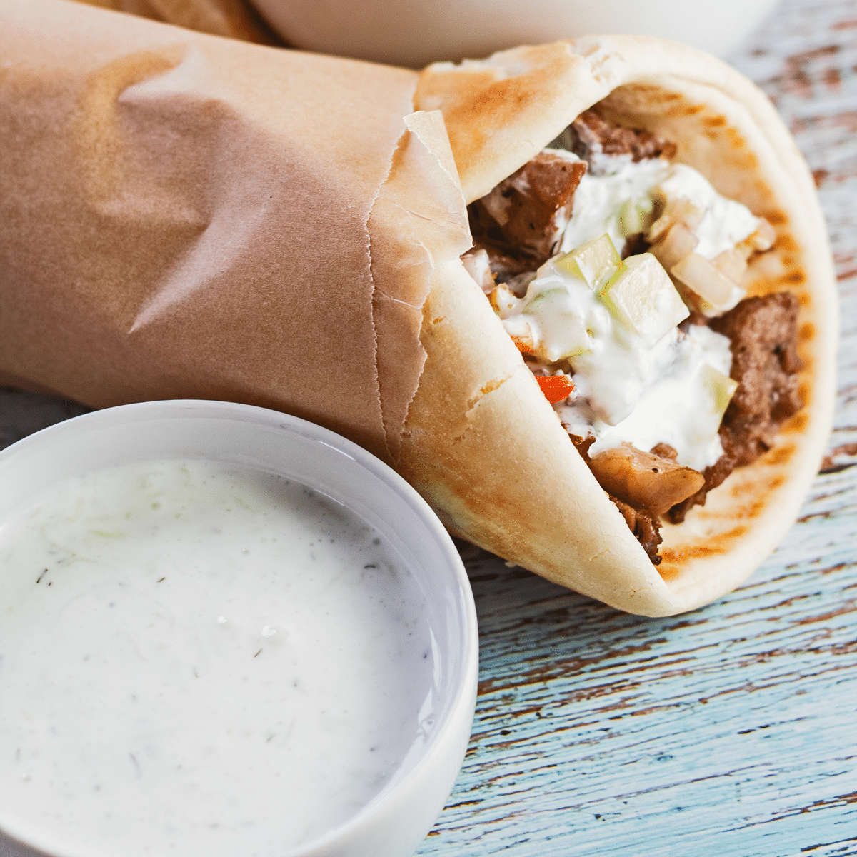 Tasty tzatziki sauce pairs well with this lamb gyros sandwich!