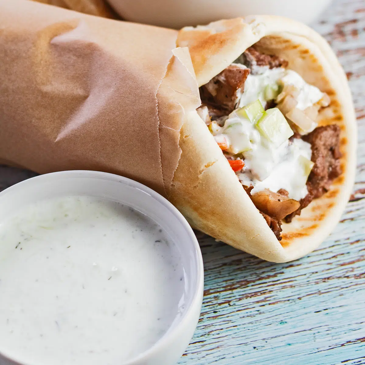 Tasty tzatziki sauce pairs well with this lamb gyros sandwich!