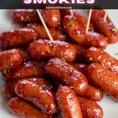 Pin image with text of bbq little smokies on a white plate with toothpicks for easy serving.