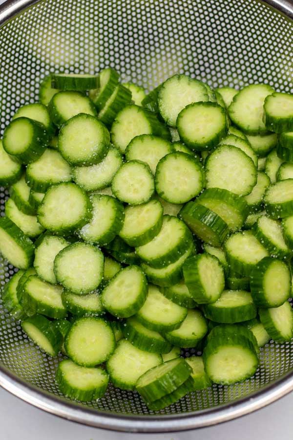 Process photo 3 slice and salt the cucumbers to wick away moisture.