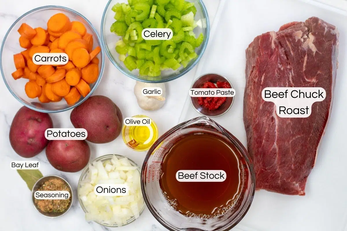 Overhead photo showing labeled dutch oven pot roast ingredients.