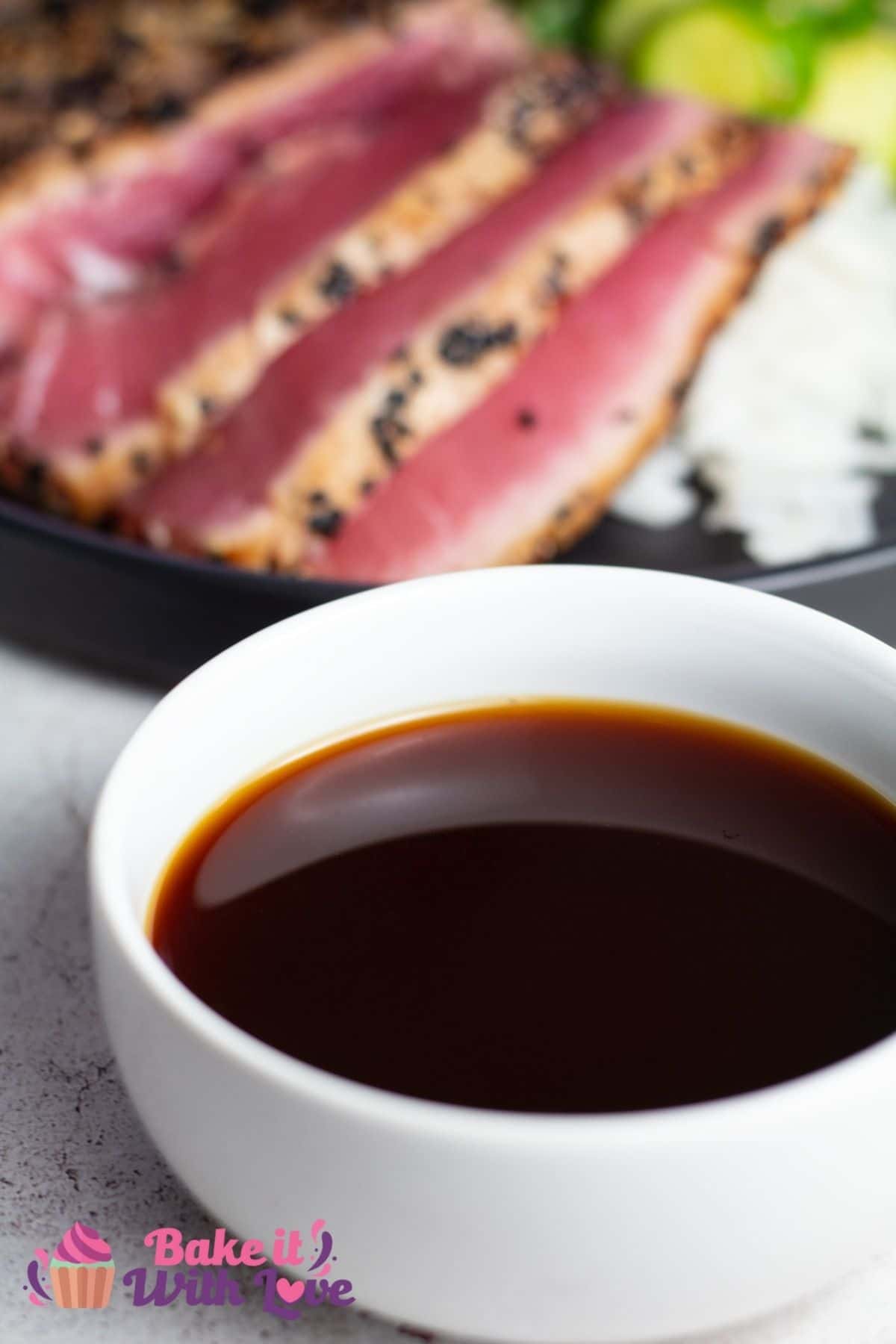 Tall image showing ponzu dipping sauce in a small white bowl.