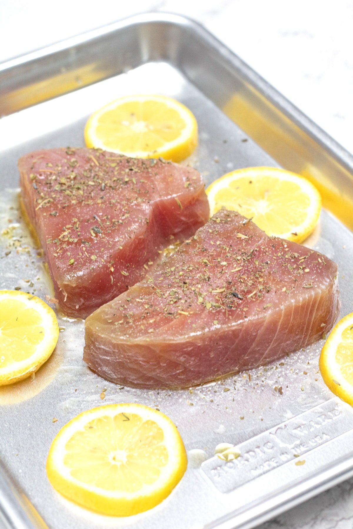 Process photo 1 of the seasoned tuna steaks on sheet pan and ready to cook.