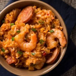 Overhead of the Instant pot jambalaya served in light beige bowl.