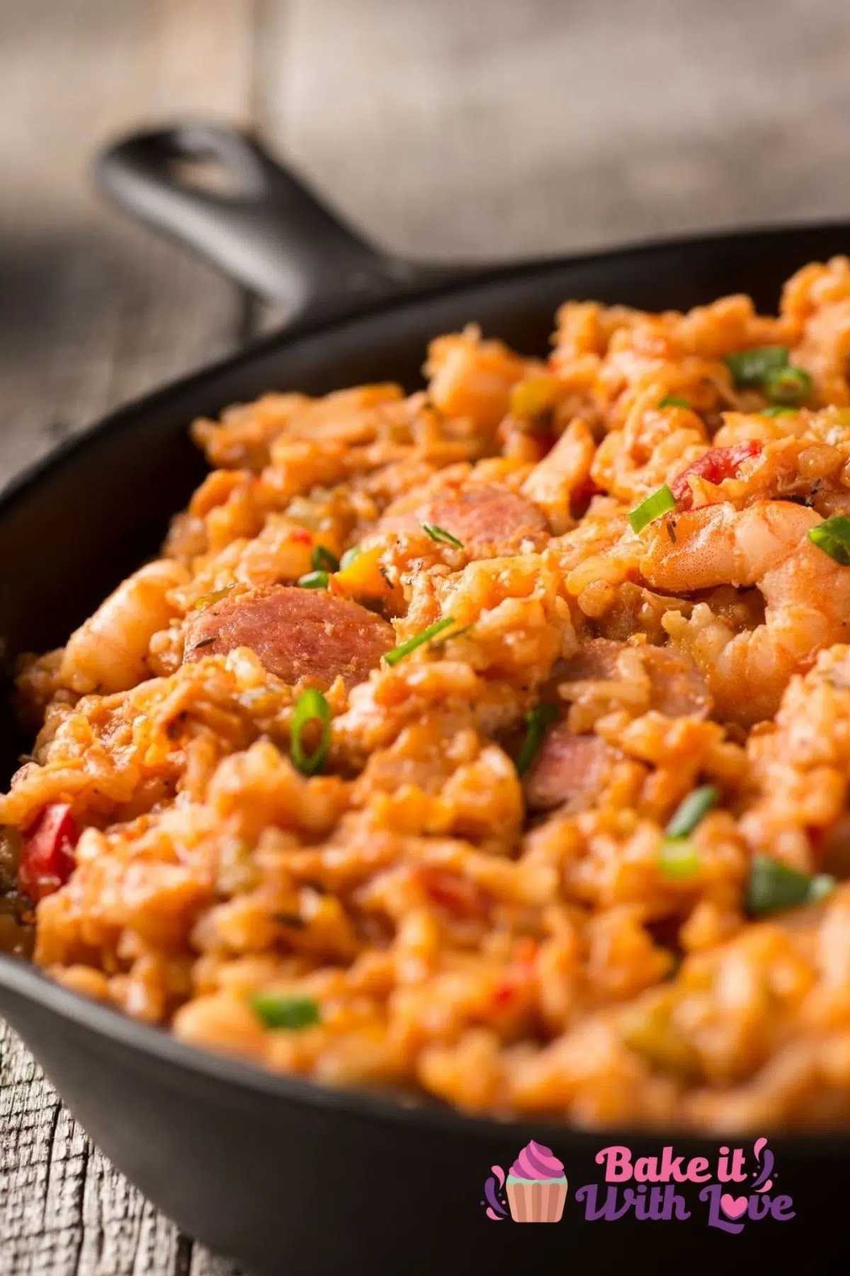 Tall closeup of the Instant Pot jambalaya being served in a cast iron skillet.