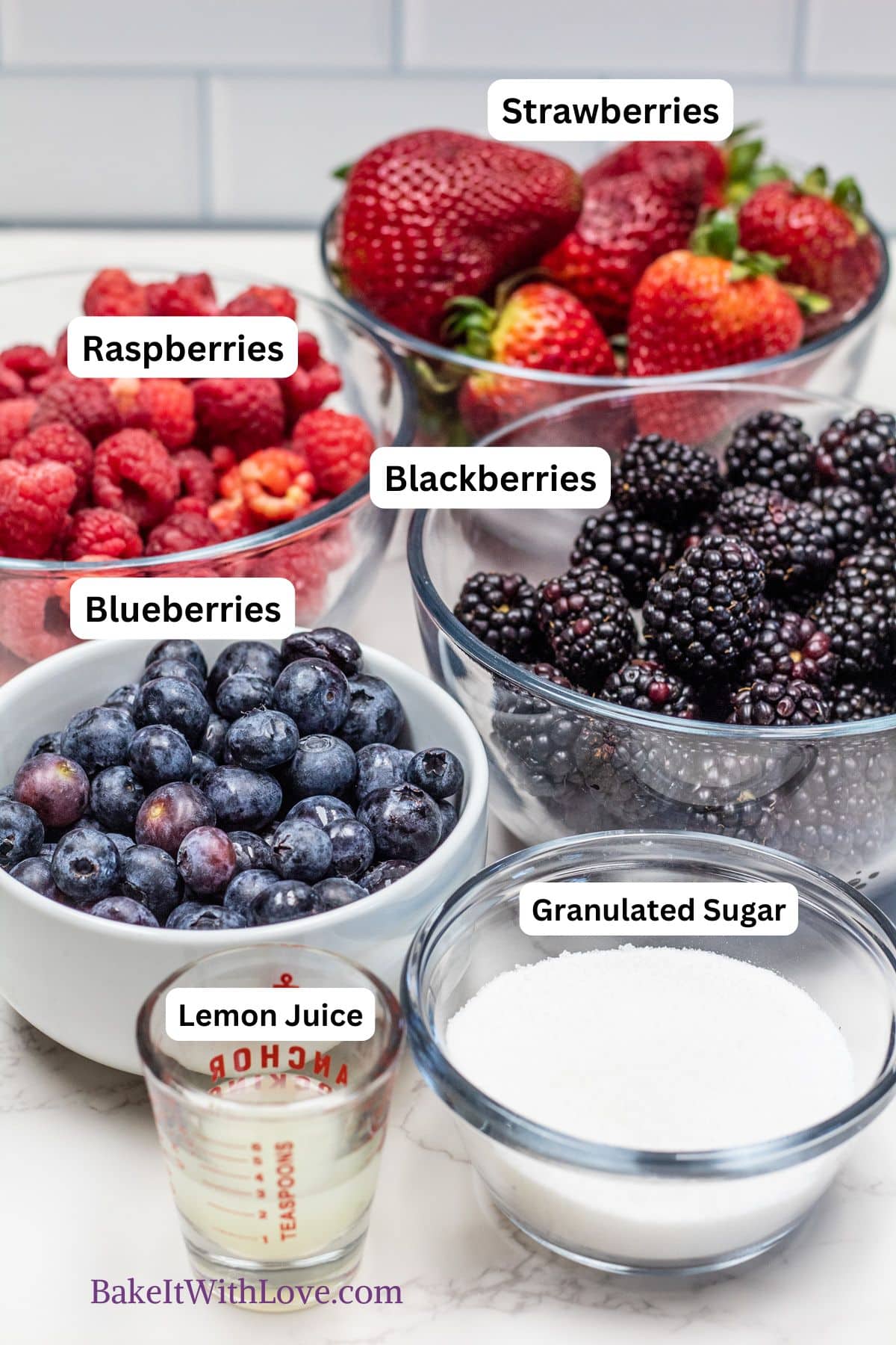 Roasted berries ingredients showing the portioned out berries, sugar, and lemon juice with labels.