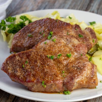 Square image of air fried coppa pork steaks.
