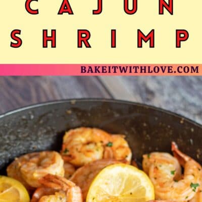 Pin image with text of cajun shrimp with lemon slices in a frying pan.