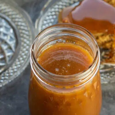 Pin image with text of English toffee sauce in a glass jar.