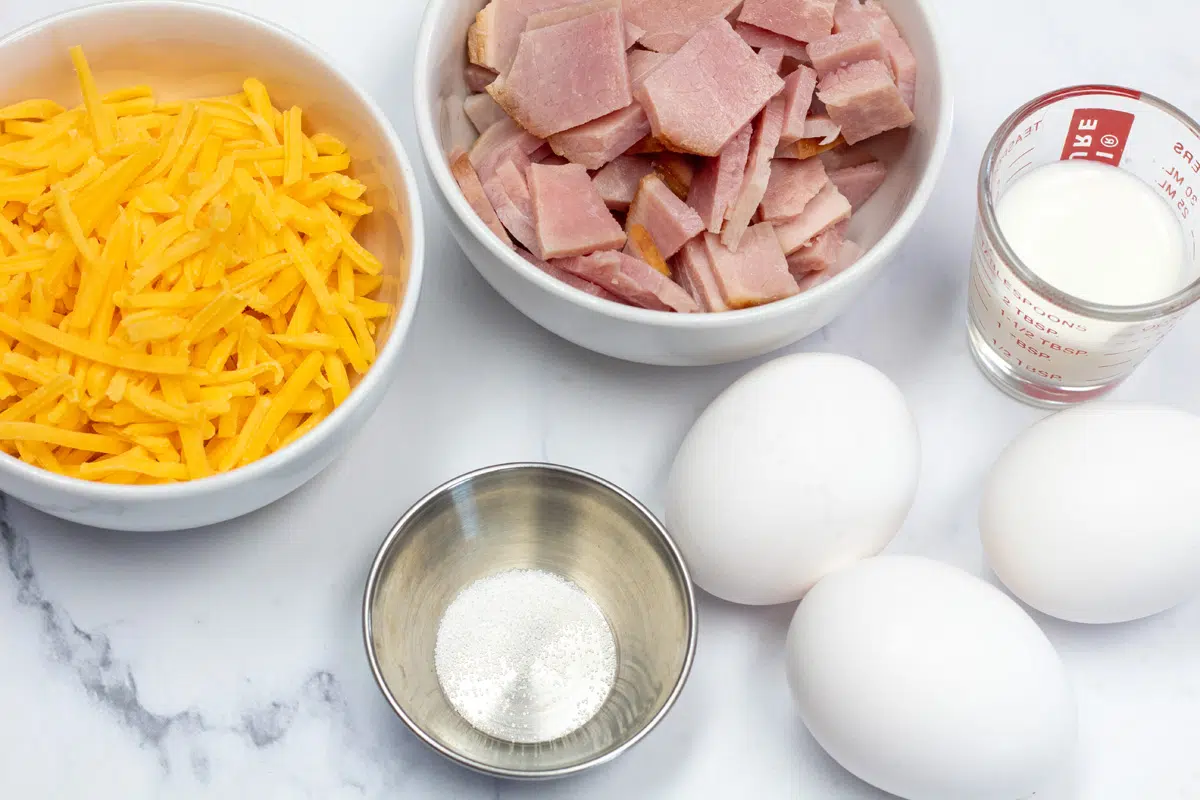 Ham and cheese omelet ingredients ready to whisk eggs and cook omelet.