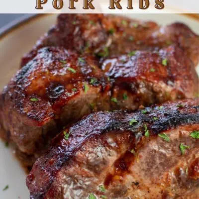 Pin image with text of intant pot bloneless country style pork ribs on a tan plate.