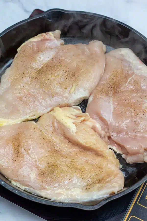 Process photo 4 sear both sides of the chicken breasts.