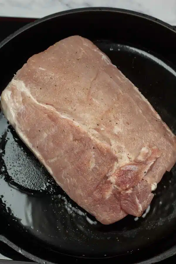 Process image 2 showing pork ribeye in cast iron.