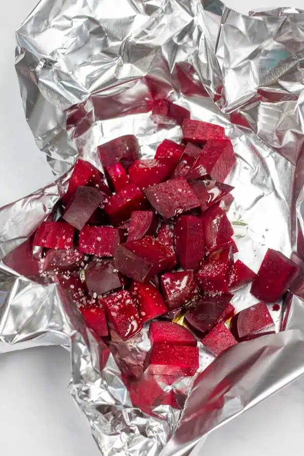 Process photo 1 chopped beets in aluminum foil pouch with olive oil and salt.