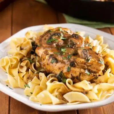 Perfectly pan seared chicken marsala with rich flavorful mushroom gravy served over al dente egg noodles.