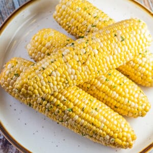 Closeup on the seasoned, buttered smoked corn on the cob.