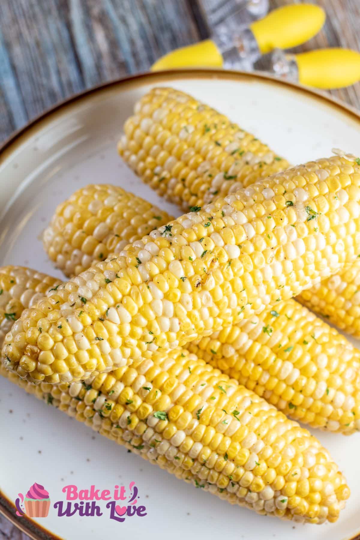 Tall overhead of the plated smoked corn on the cob ready to serve.