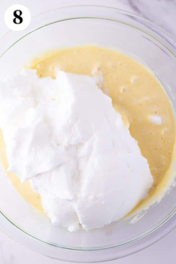 Tres leches cake process photo 8 add egg whites to cake mixture.