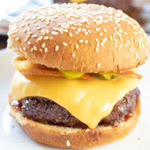 Square image of baked cheeseburger.