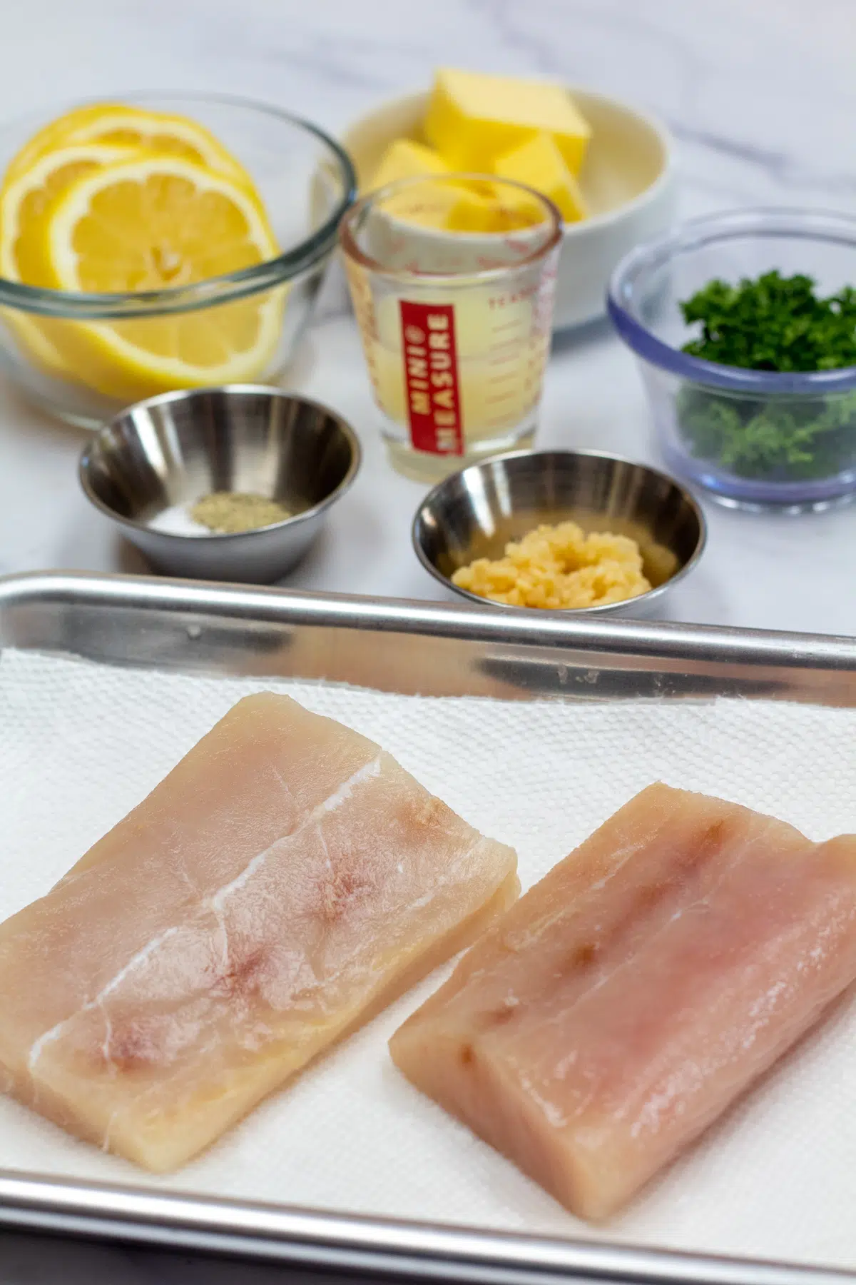 Tall photo showing ingredients needed for baked mahi mahi.